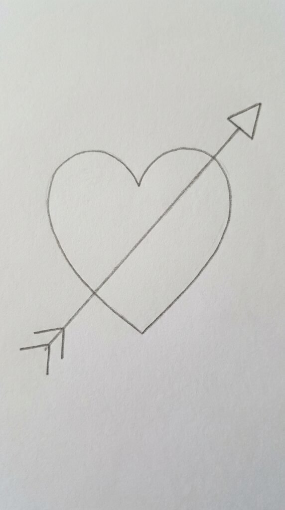 Pencil drawing of an arrow passing through a heart shape, simple love drawing idea for beginners.