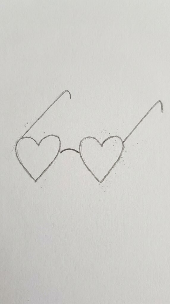 Simple pencil drawing of heart shaped sunglasses, cute love drawing idea for beginners.
