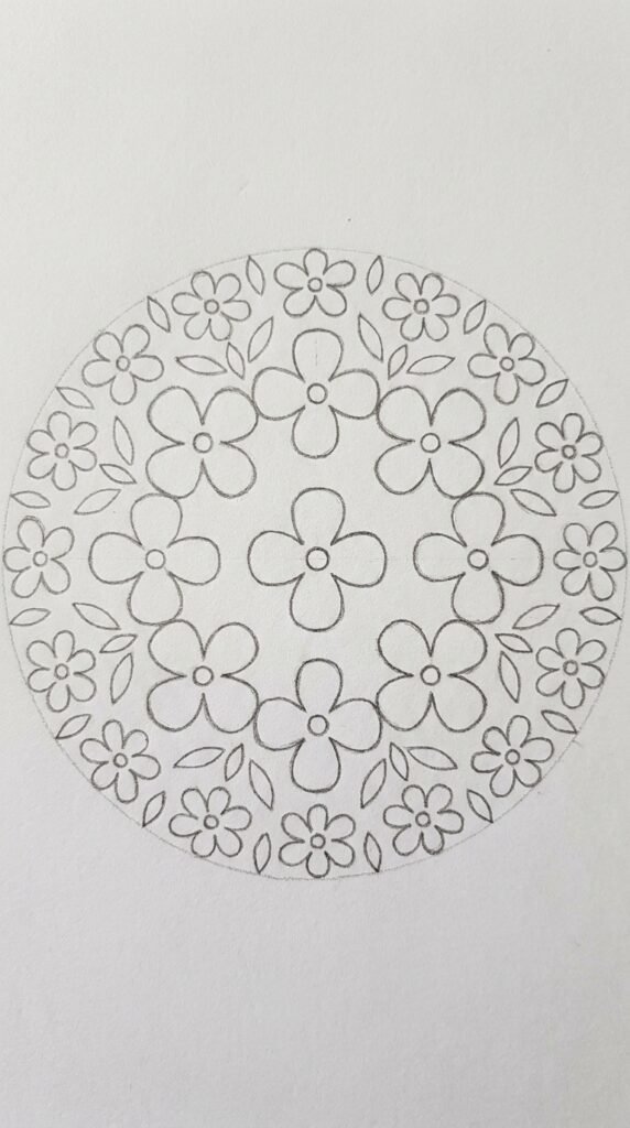 Pencil drawing of a mogra mandala with concentric rings of jasmine flowers arranged in a circular symmetrical pattern on white paper.