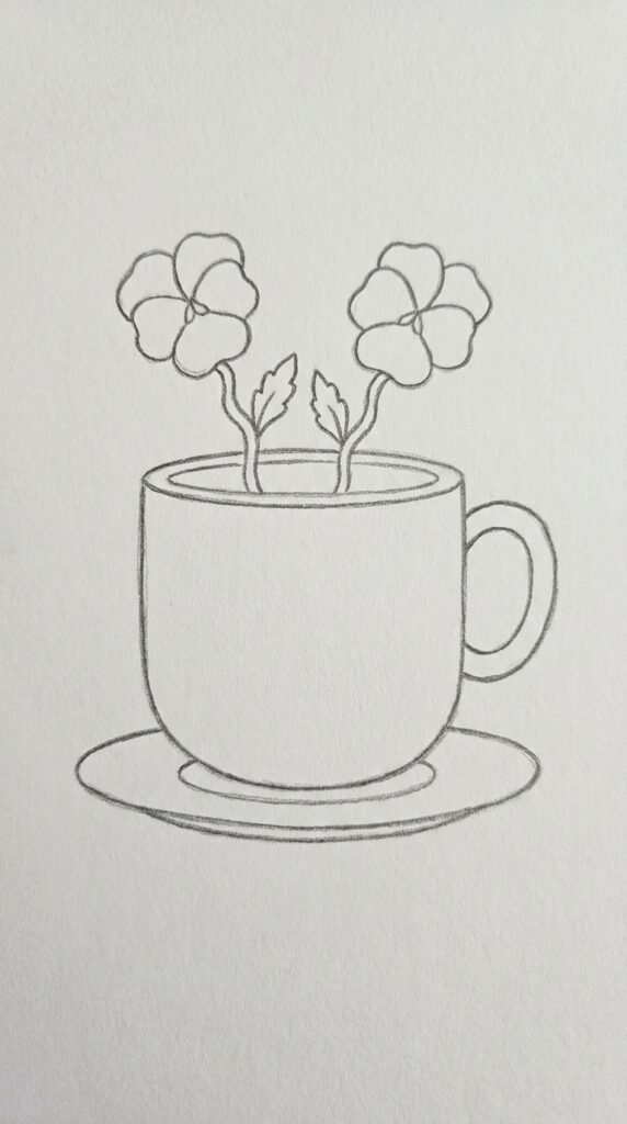 Simple pencil sketch of a small pansy flower growing from a decorative teacup with a saucer, handle, and two small leaves on white paper.