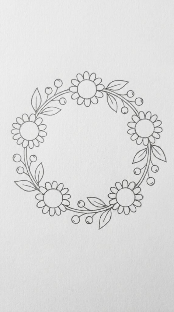  Pencil sketch of a circular sunflower wreath with flowers, leaves, and berries arranged in a ring on white paper.