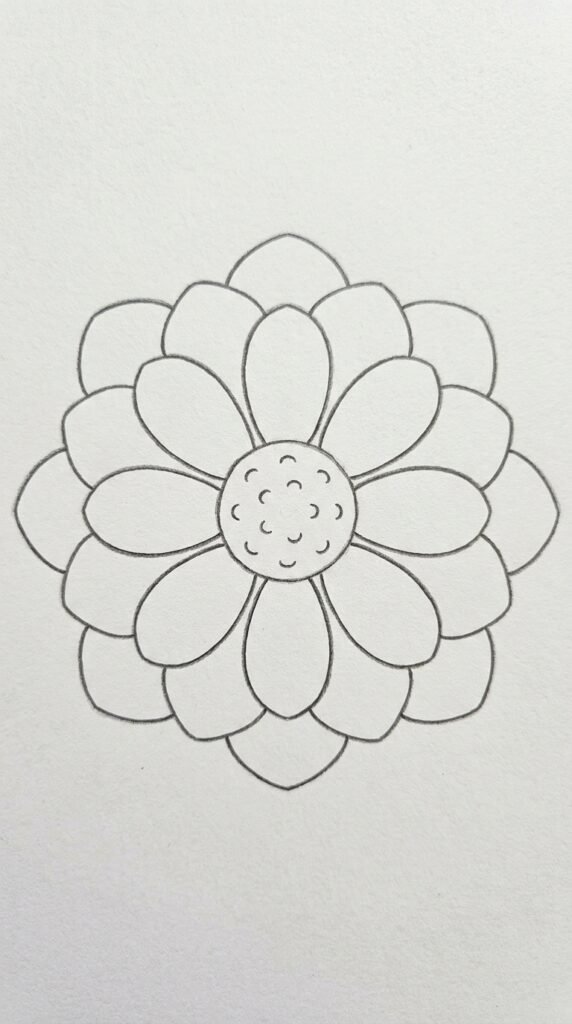 Top-view lotus drawing pencil sketch with two rings of petals and a textured center on white paper.