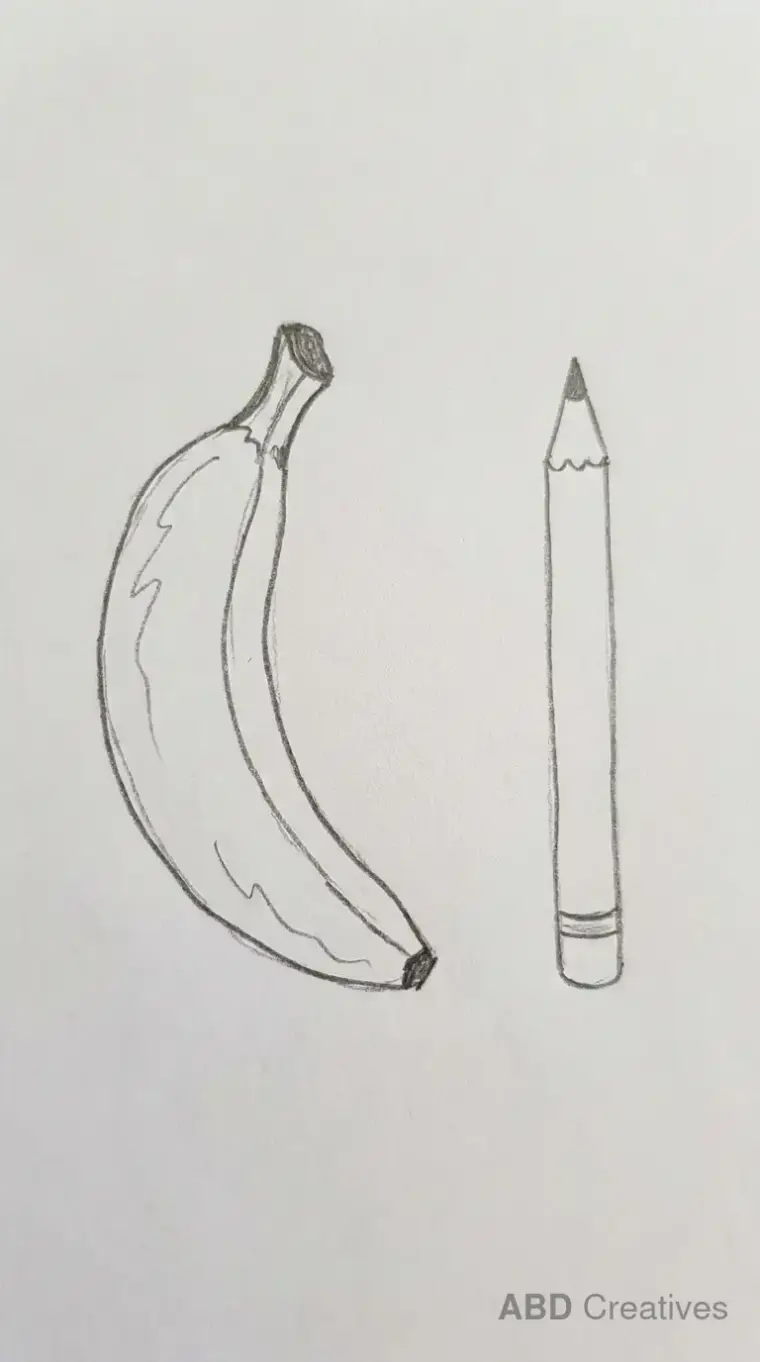 Banana Beside a Pencil