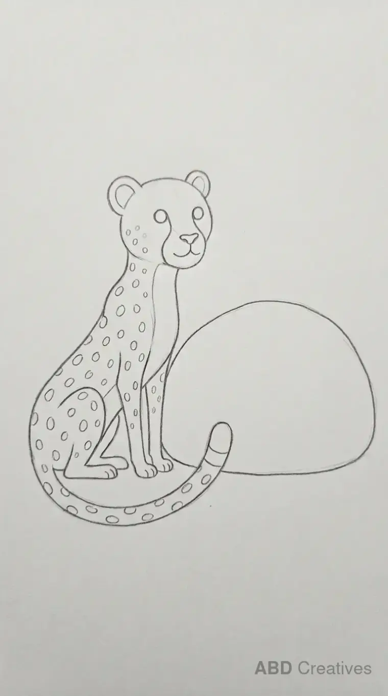 Cheetah Sitting Beside Rock