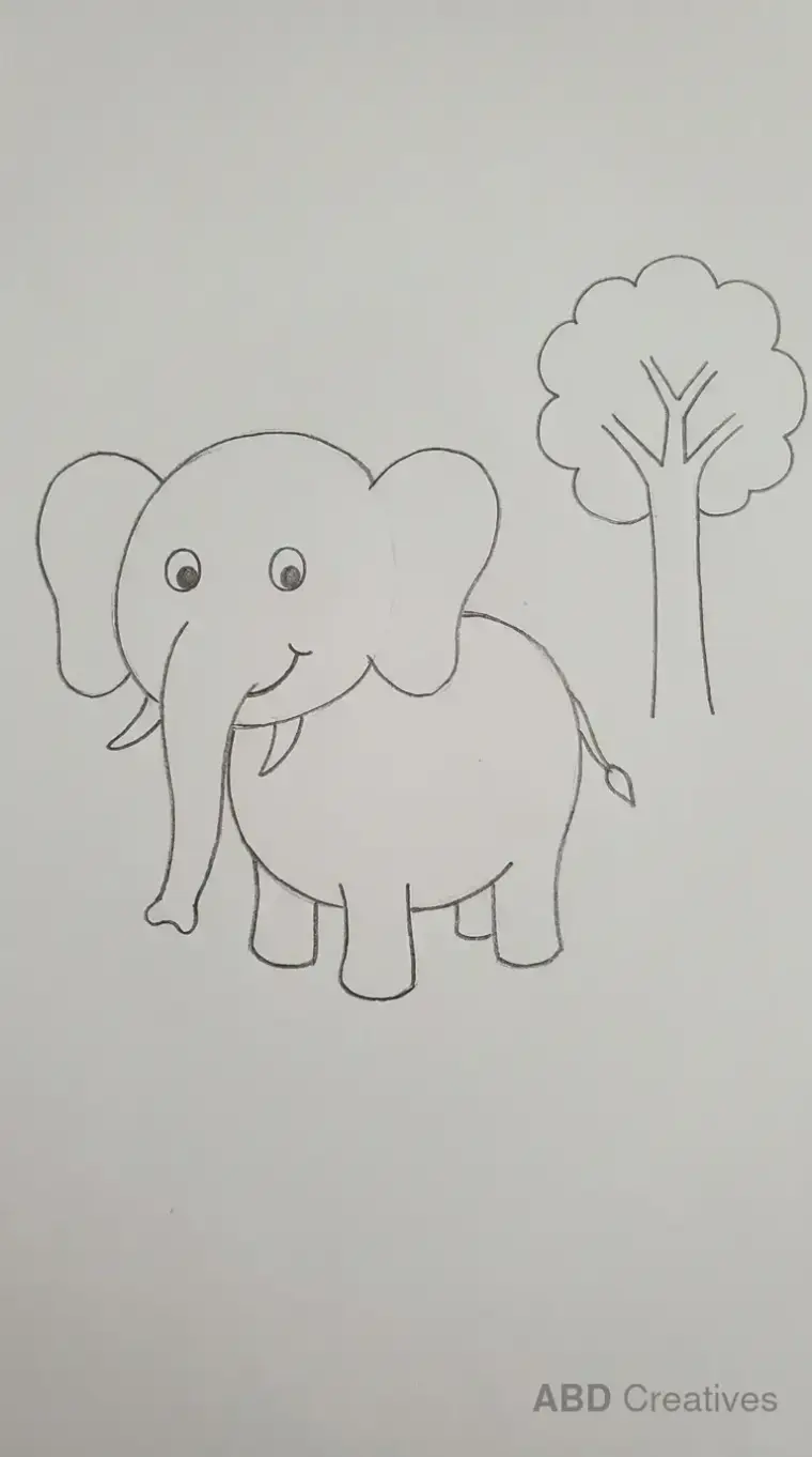 Elephant Standing Beside a Tree