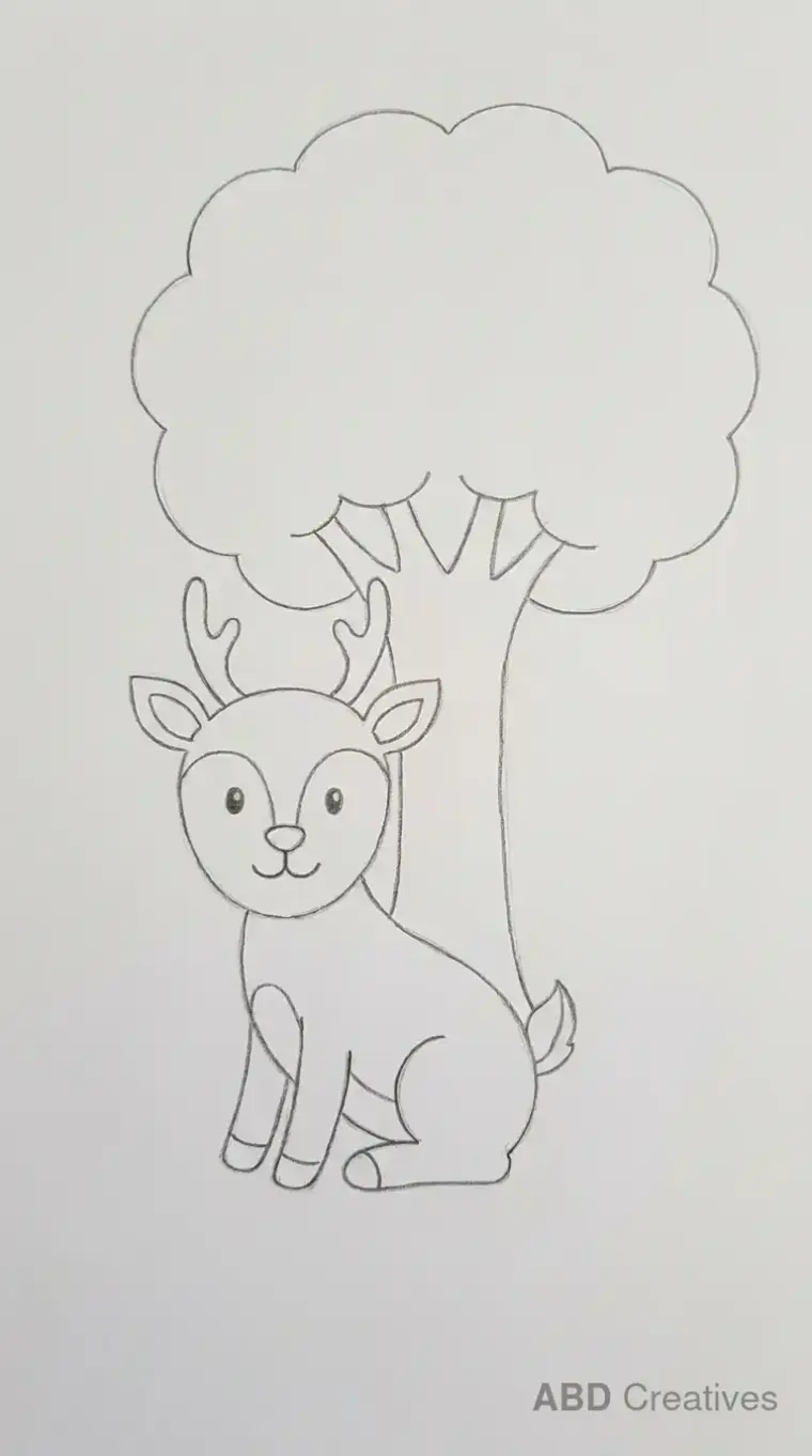 Deer Sitting Under a Tree