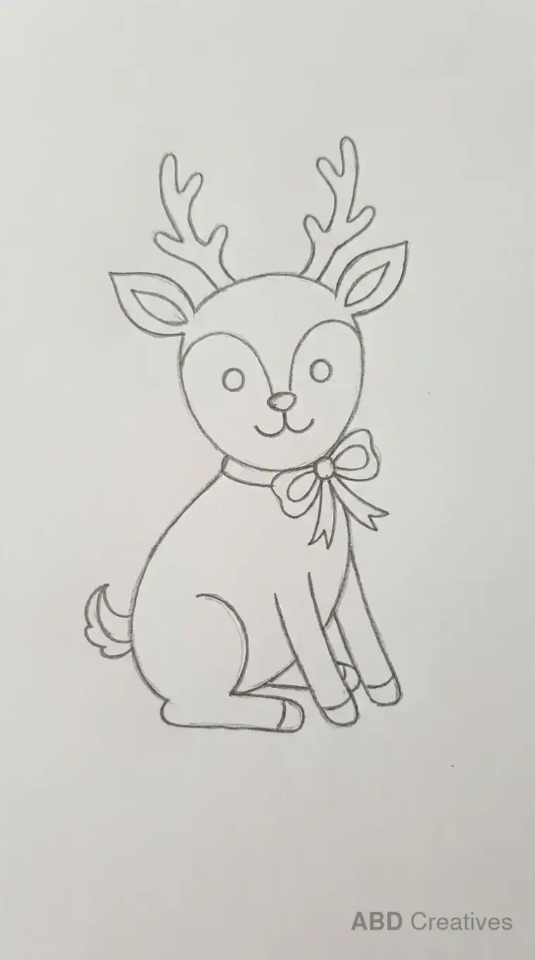 Sitting Deer Wearing a Bow